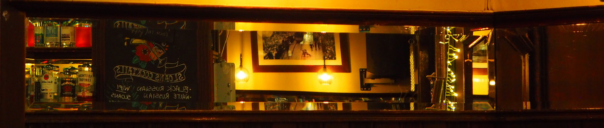 Mirror showing a typical Scottish pub.